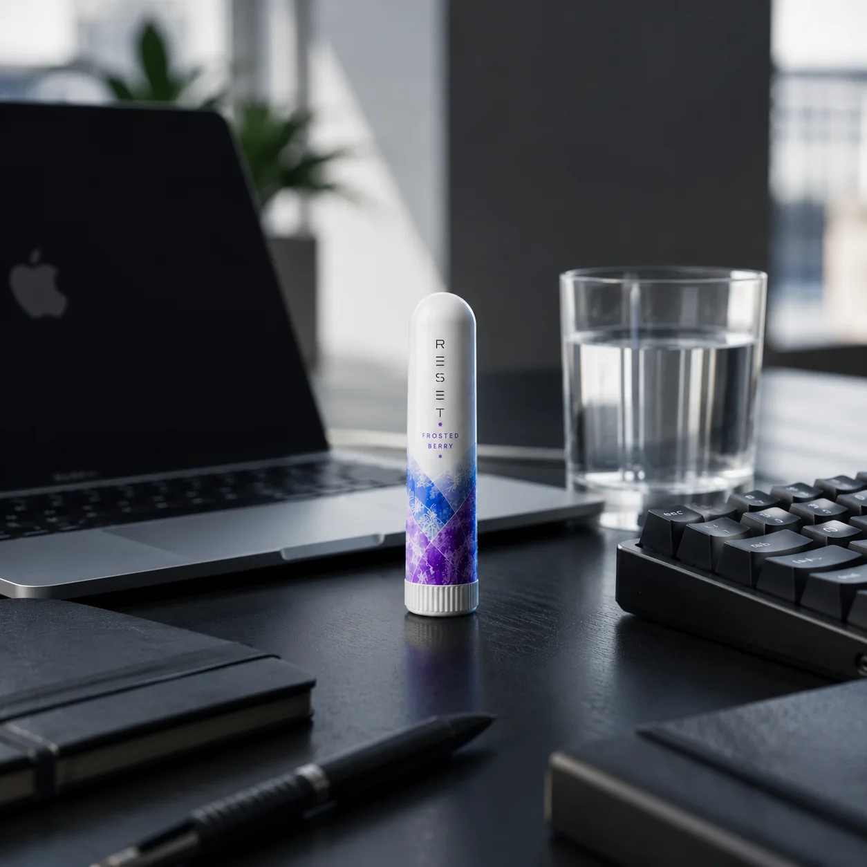 RESET Frosted Berry on a premium modern workspace